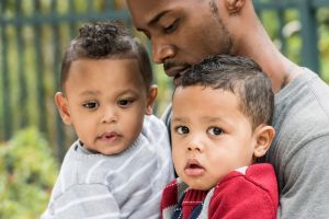 Little twins with their dad