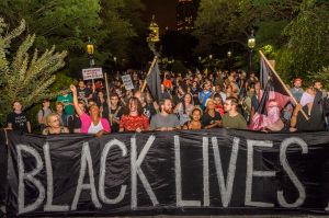 The families of victims of police brutality, community...