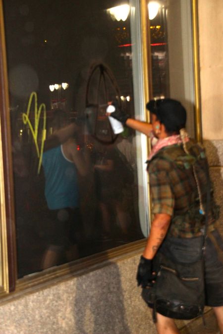 Tagger Defacing Property During Protests