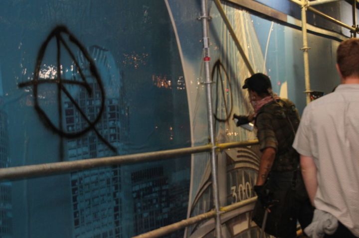 Tagger Defacing Property During Protests