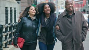 Senior Couple Walk with their Adult Daughter WS