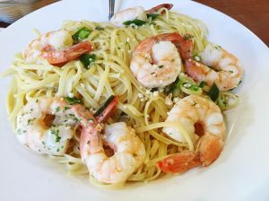 High Angle View Of Pasta And Shrimps In Plate On Table