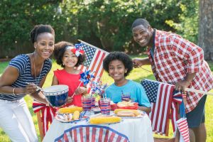 Family with two children celebrating 4th of July