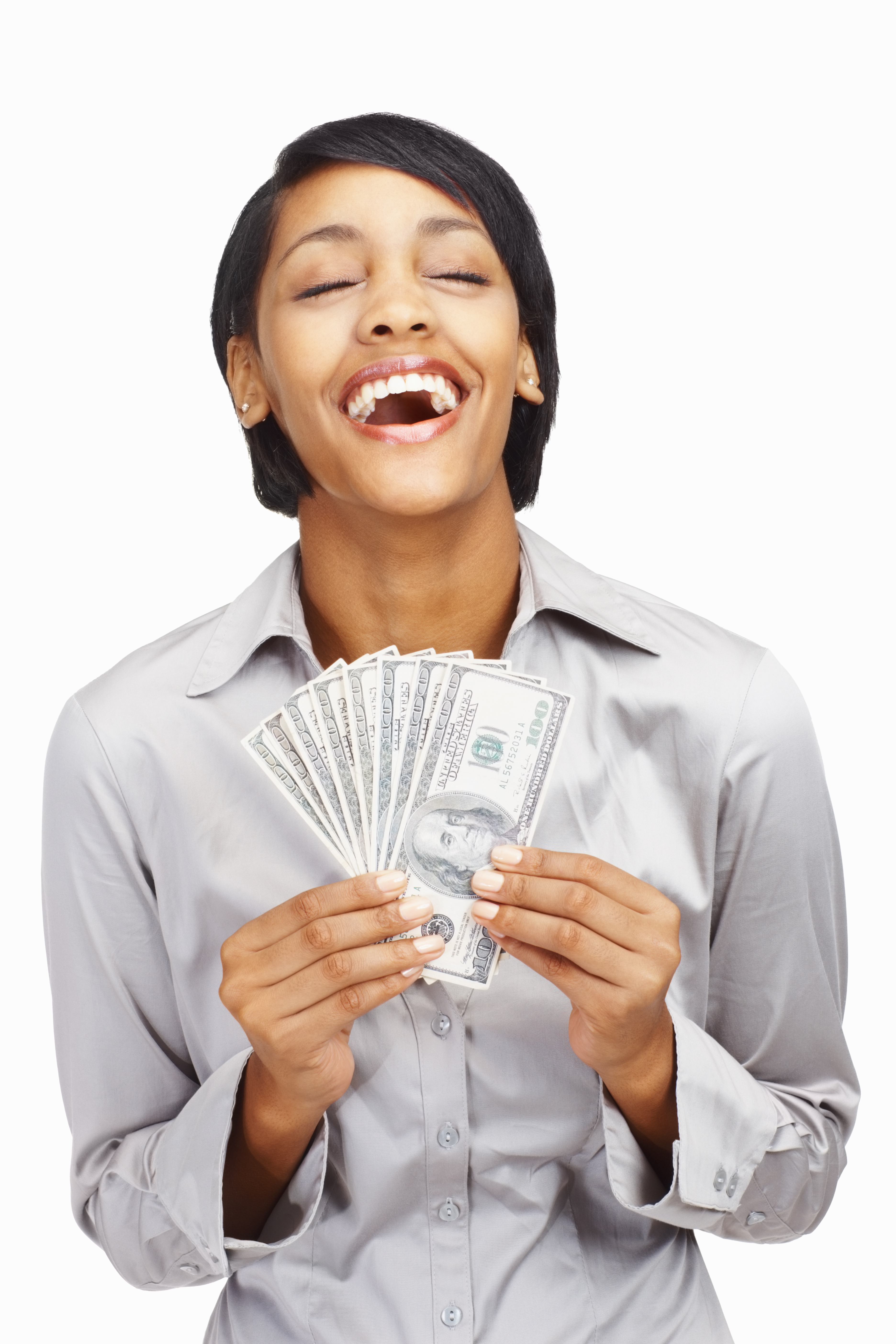 Happy young business woman holding currency notes against white