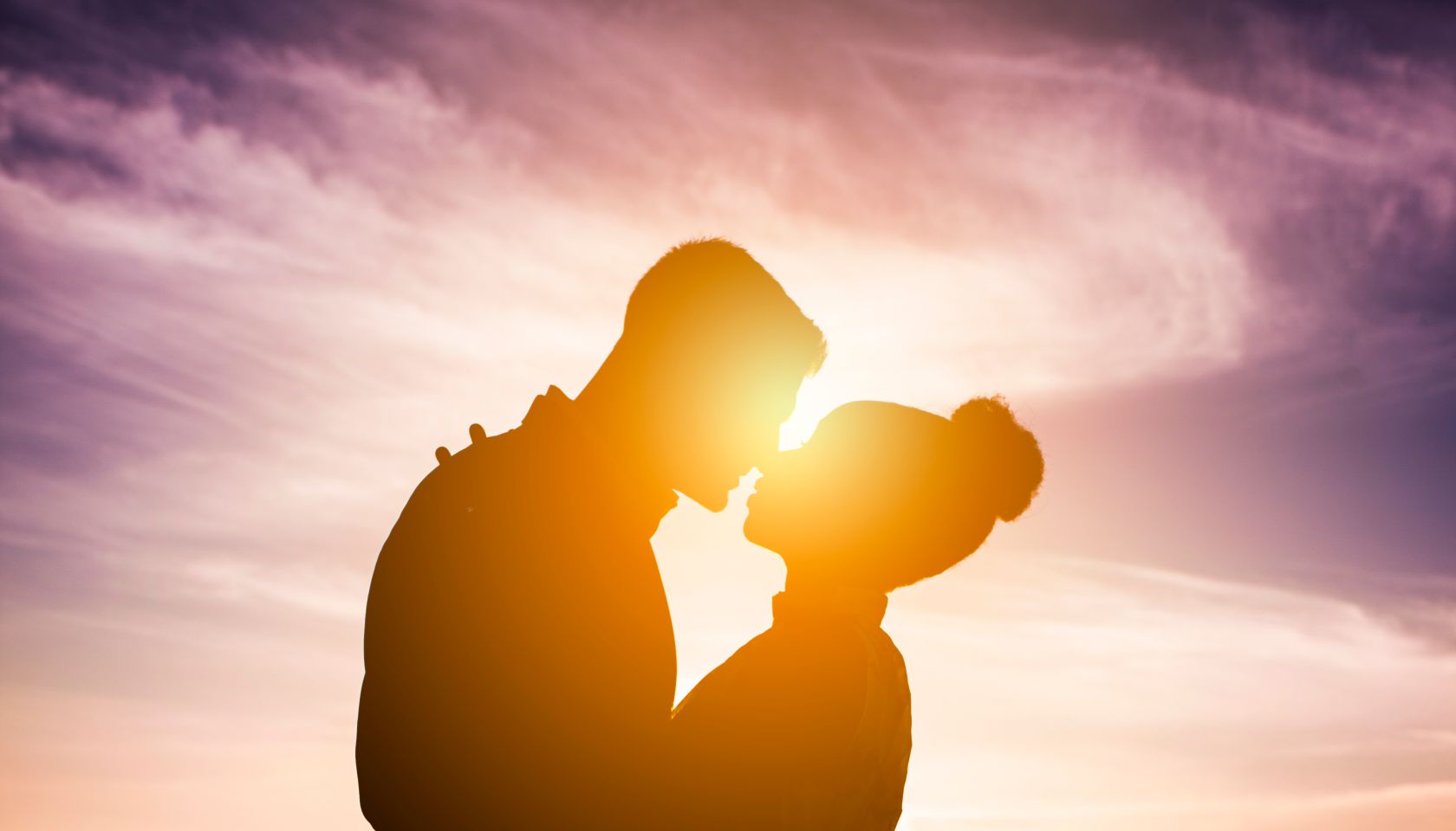 Diverse Couple Engagement Silhouettes at Sunset