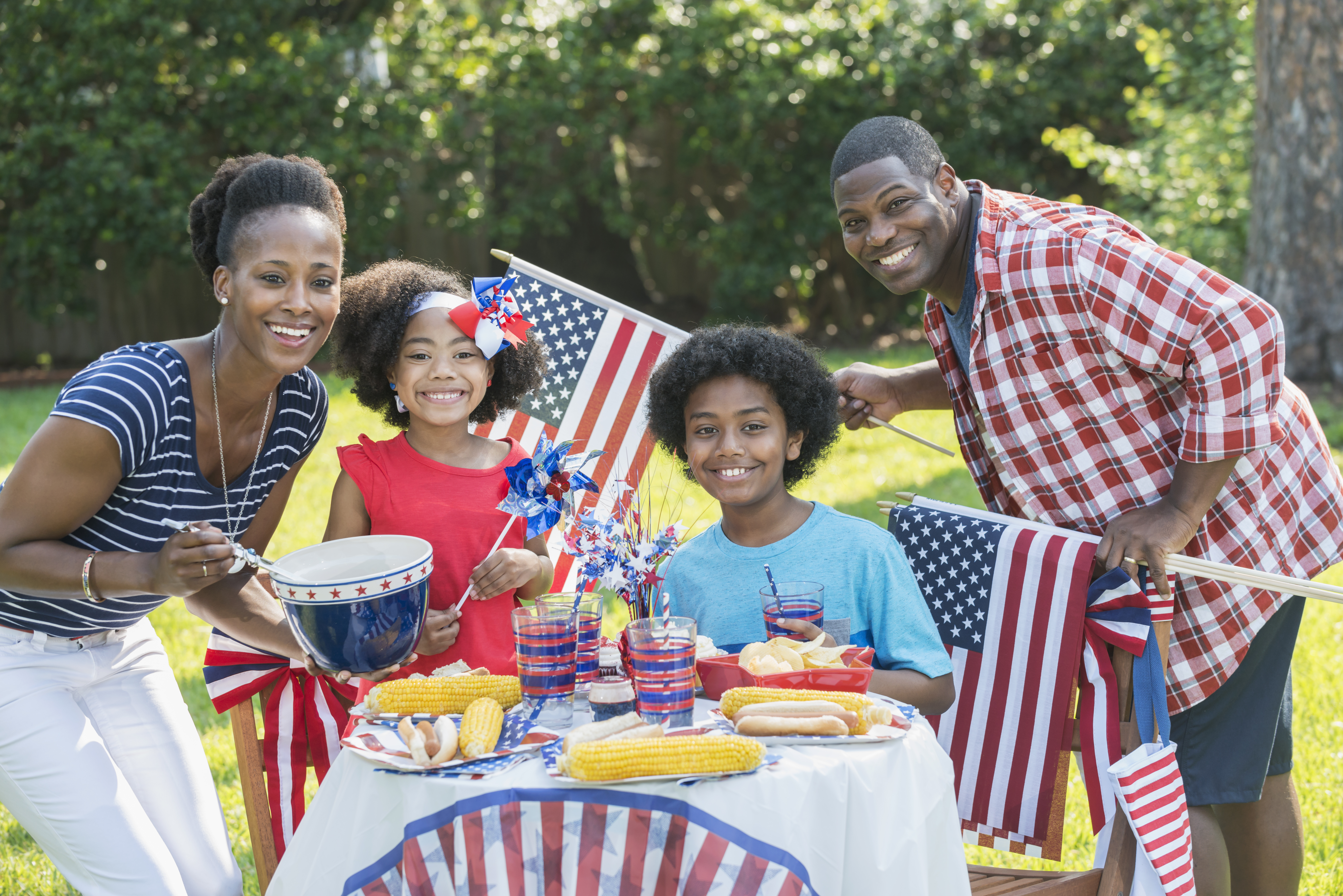Family with two children celebrating 4th of July