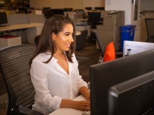 Latino Woman At Desk