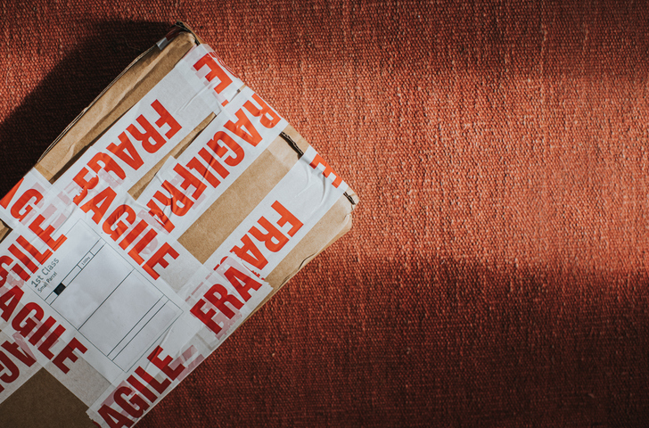 A package covered in fragile warning tape