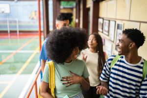 Teeange students walking and talking at school