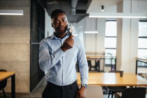 Businessman take off protective mask during work tim