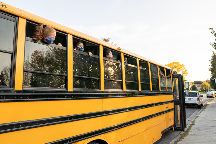 Saying Hello out the School Bus Window