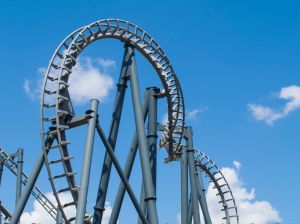 Low Angle View Of Ferris Wheel Against Blue Sky