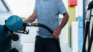 Man refueling his car at gas station