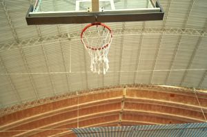 Basketball over hoop at court