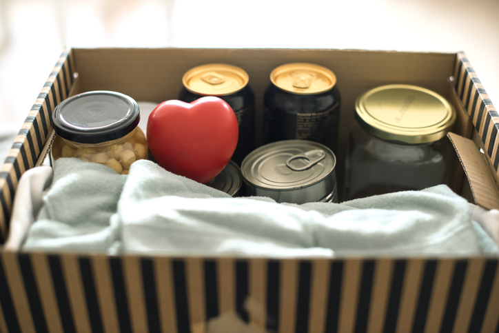 Close up of woman packing donation box