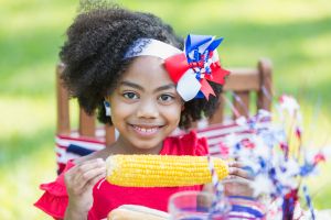 Cute little mixed race girl at Memorial Day cookout