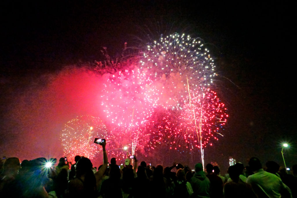 Crowds watching Macy's Fourth of July fireworks display, Manhattan