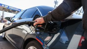 Customer refuels his car at Long Island gas station