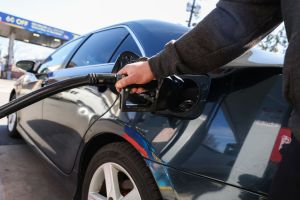 Customer refuels his car at Long Island gas station