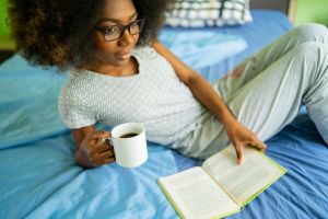 Reading and coffee in bed