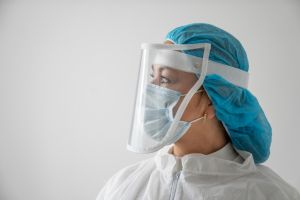 Thoughtful doctor at the hospital wearing PPE during the COVID-19 pandemic