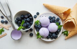 Homemade blueberry ice cream with fresh blueberries