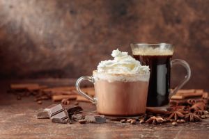 Hot chocolate with whipped cream and black coffee.