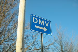 DMV sign street showing where to get drivers registration