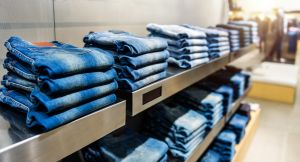 Row of blue jeans in a shop