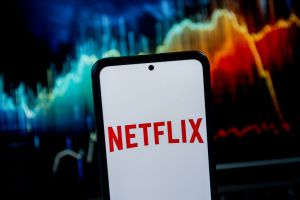 In this photo illustration a Netflix logo seen displayed on...