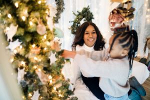 Family Decorating Christmas Tree With Ornaments