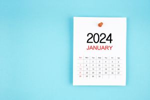 January 2024 calendar page with push pin on blue background.