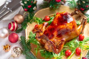 Roasted whole chicken with Christmas decoration.