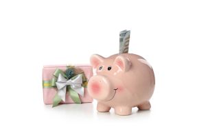 Concept of Christmas finance with piggy bank, isolated on white background