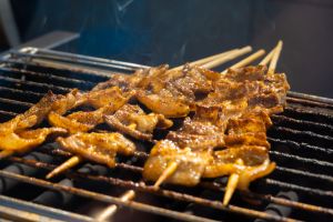 Grilled meat on the grill in the restaurant. Street food.