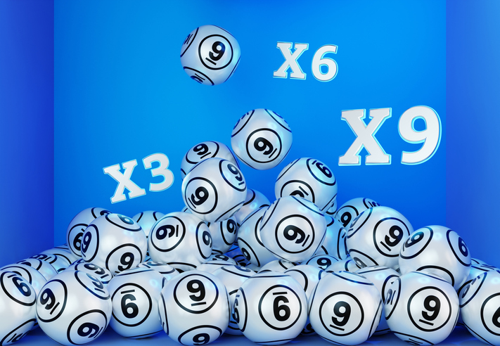Lottery balls and number 9 on them with clipping path on blue background