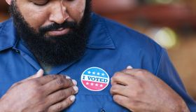 African-American working class man with I Voted sticker