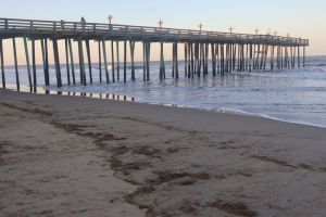 View of pier on beach against clear sky,North Carolina,United States,USA
