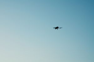 A flying drone against sky