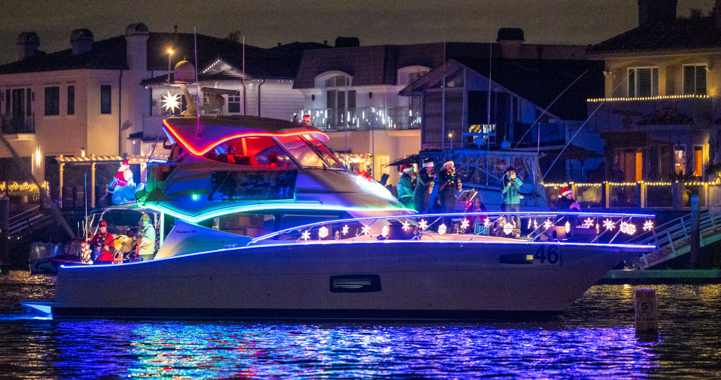 Holiday lights and decorations cover dozens of boats during the 60th annual Huntington Harbour Boat Parade