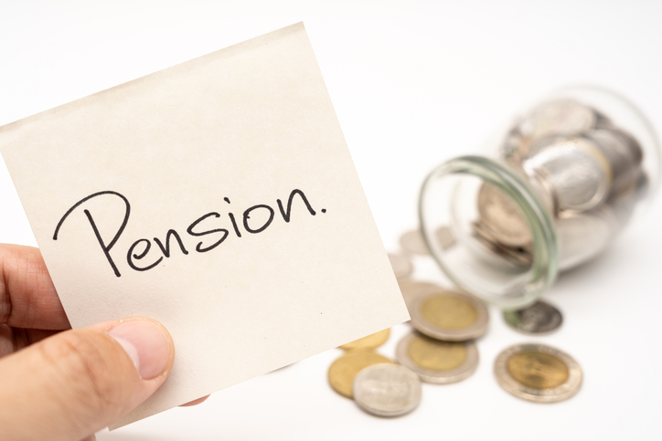 Pension Text on paper note with Thai Baht Coins spilled out of jar glass background, saving for future, Investment business concept.