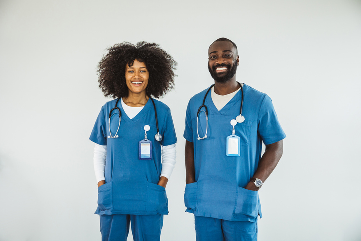 Portrait of doctors standing with arms crossed
