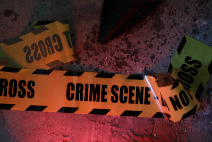 Evidence Markers Line the Floor as Forensic Team Probes Crime Scene