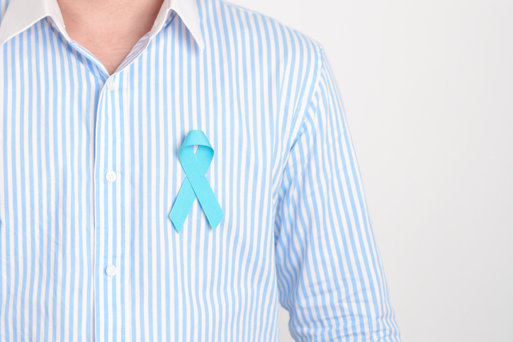 Man with blue Ribbon for concept of blue November, November Prostate Cancer Awareness month, World Diabetes day , Men Health month, International men, Father day. Healthcare and world cancer day