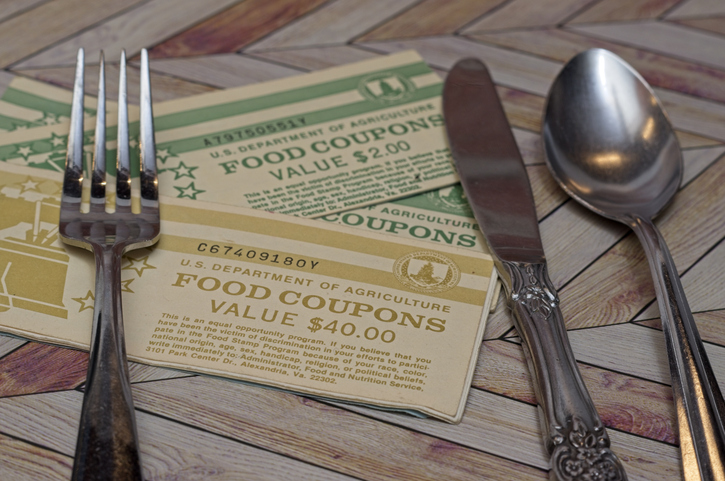 Paper food stamp coupons with silverware