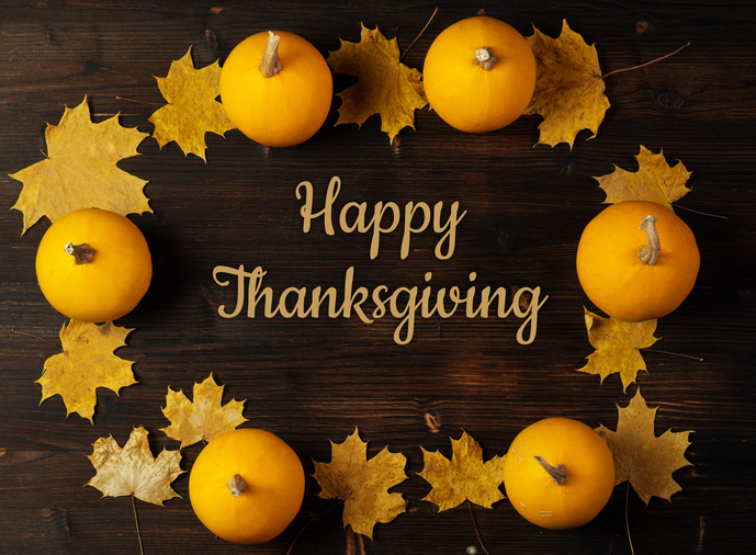 Happy Thanksgiving greeting. Frame of pumpkins and yellow maple leaves, top view.