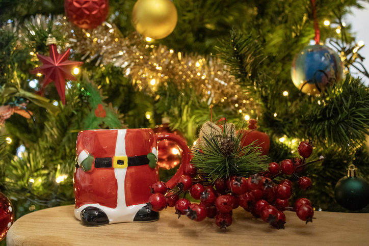 Ceramic coffee mug designed to look like Santa Claus's red suit