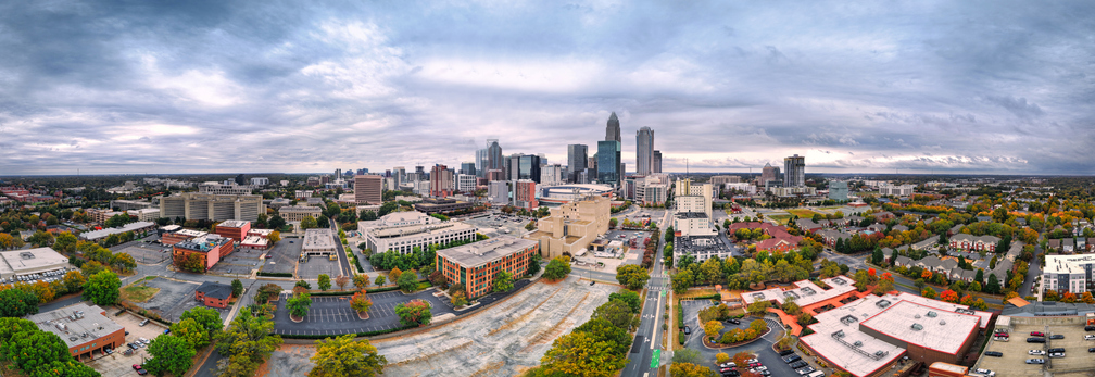 Aerial View of Charlotte North Carolina Modern Skyline Set Against Dark, Dramatic Cloudy Skies Above
