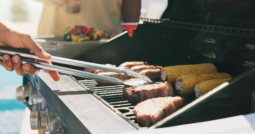 Bbq, steak and cooking with hands of person outdoor for grill, cookout event and beef. Summer vacation, weekend break and tongs with people and barbecue in backyard of home for meat, support and corn