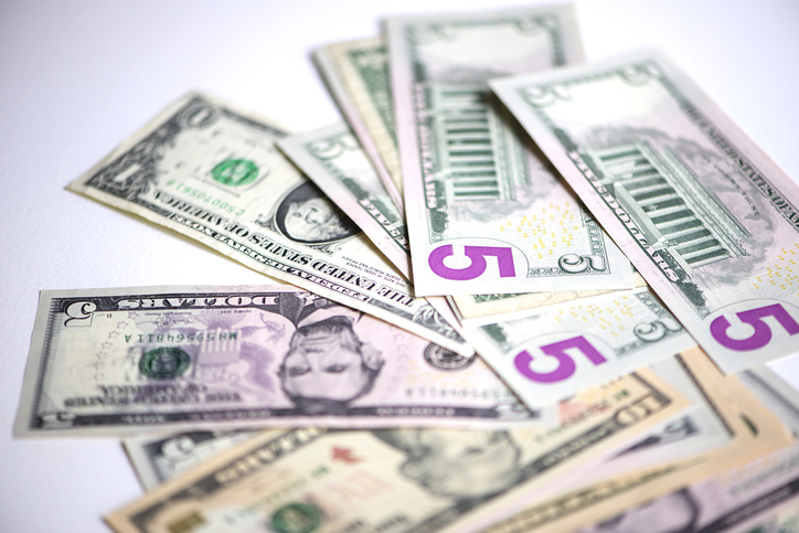 A part of US dollars on white background